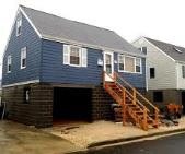 New Jersey home raised and placed on concrete foundation.